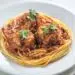 Easy Turkey Balls With Red Sauce On Top Of Pasta