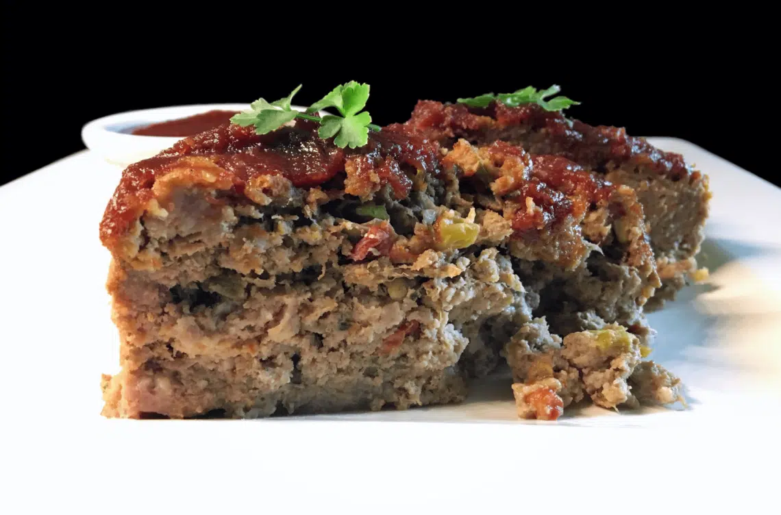 A Slice Of Tasty And Easy Southwestern Style Meatloaf Recipe On A White Plate