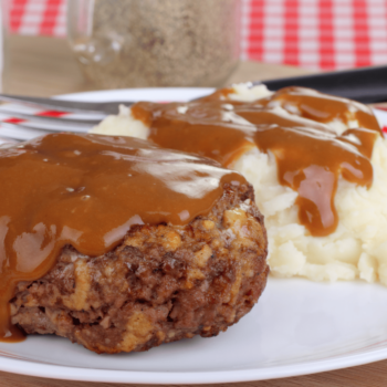Delicious Venison Hamburger Steak with Gravy and Mashed Potato on a Plate