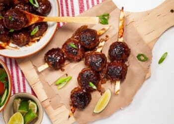 Delicious Bbq Meatballs Skewed And In White Plate