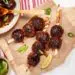 Delicious Bbq Meatballs Skewed And In White Plate