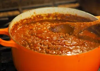 Awesome And Easy Meat Sauce Recipe Cooking In An Orange Casserole