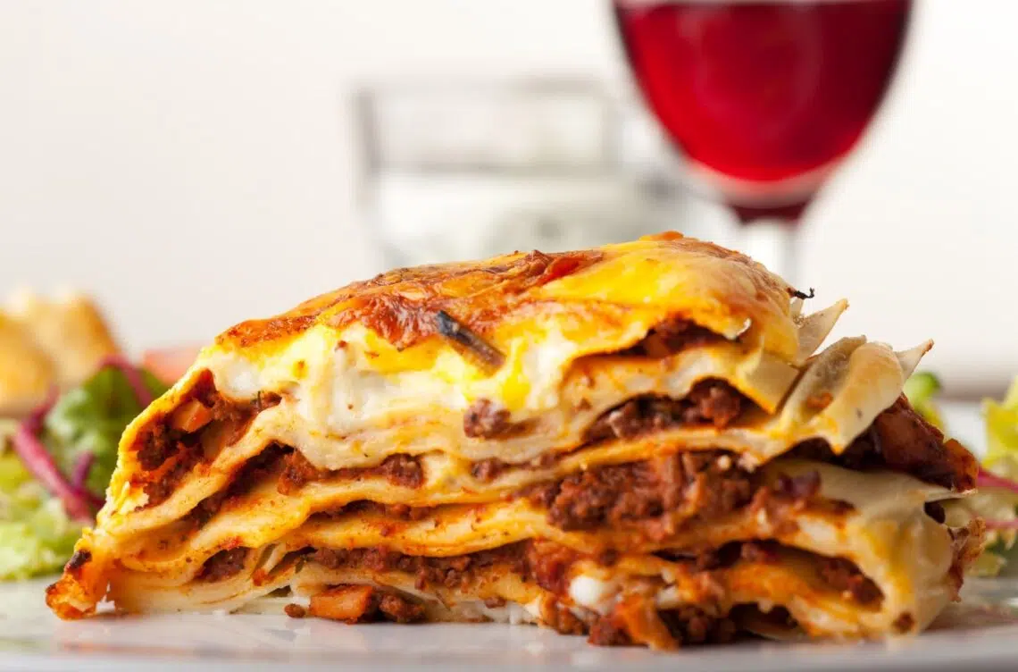 The Best Lasagna Recipe In The World Served With Wine And Salad