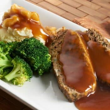 Two Slices of The Most Amazing Grilled 3-Meat Meatloaf With Mashed Potato and Broccoli