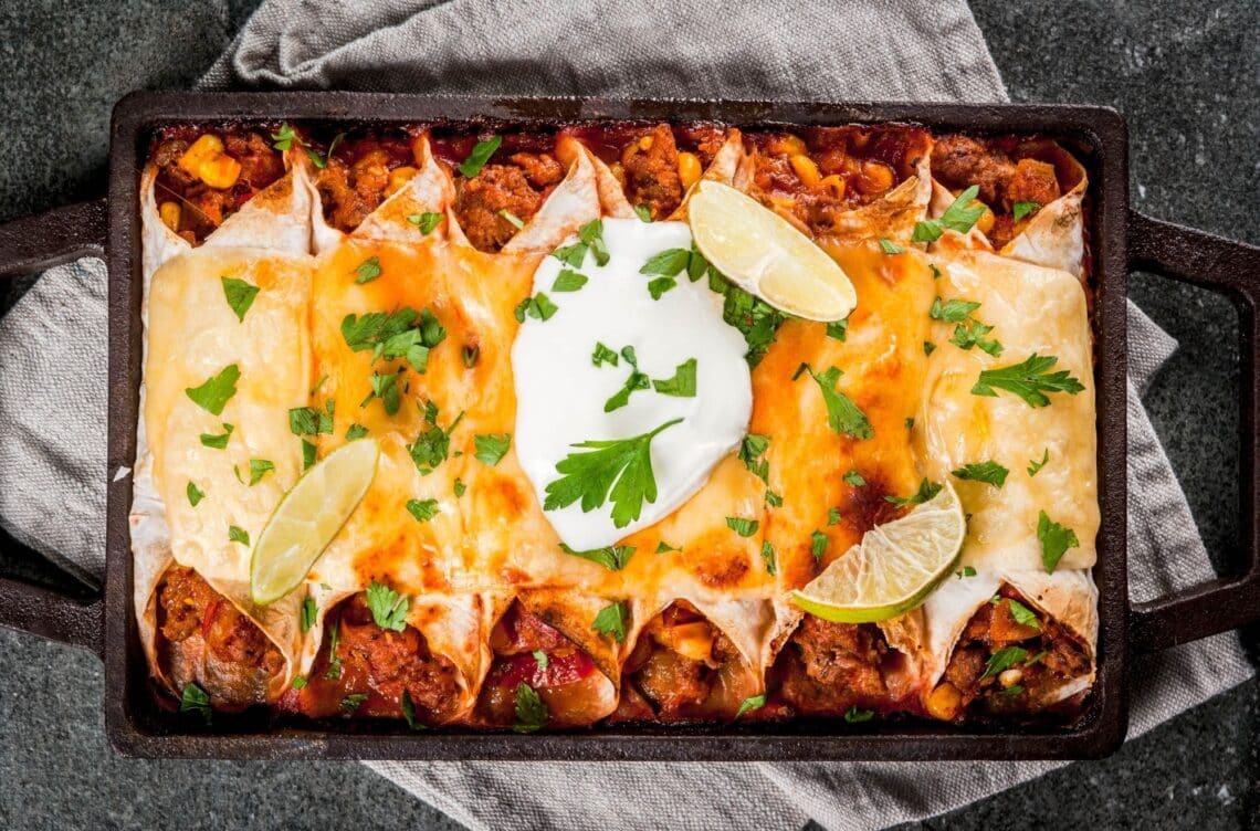 Baked Beef Enchiladas Lined In A 13 By 9 Dish