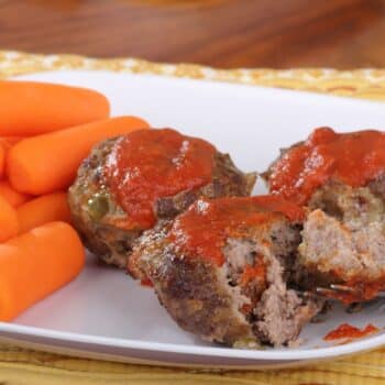 Easy BBQ Meatloaf Muffins On A White Plate With Carrots On The Side