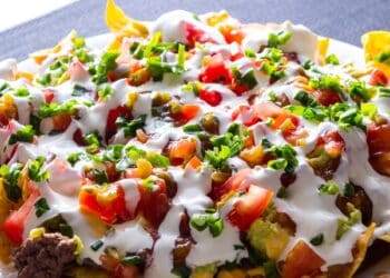 The Best Mouthwatering Taco Casserole With Shredded Lettuce And Sour Cream On Top