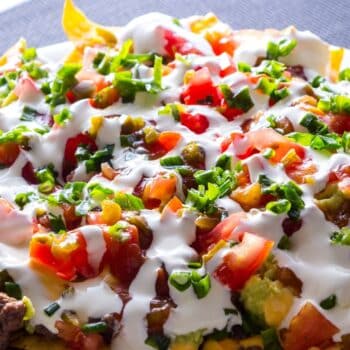 The Best Mouthwatering Taco Casserole With shredded lettuce and sour cream on top