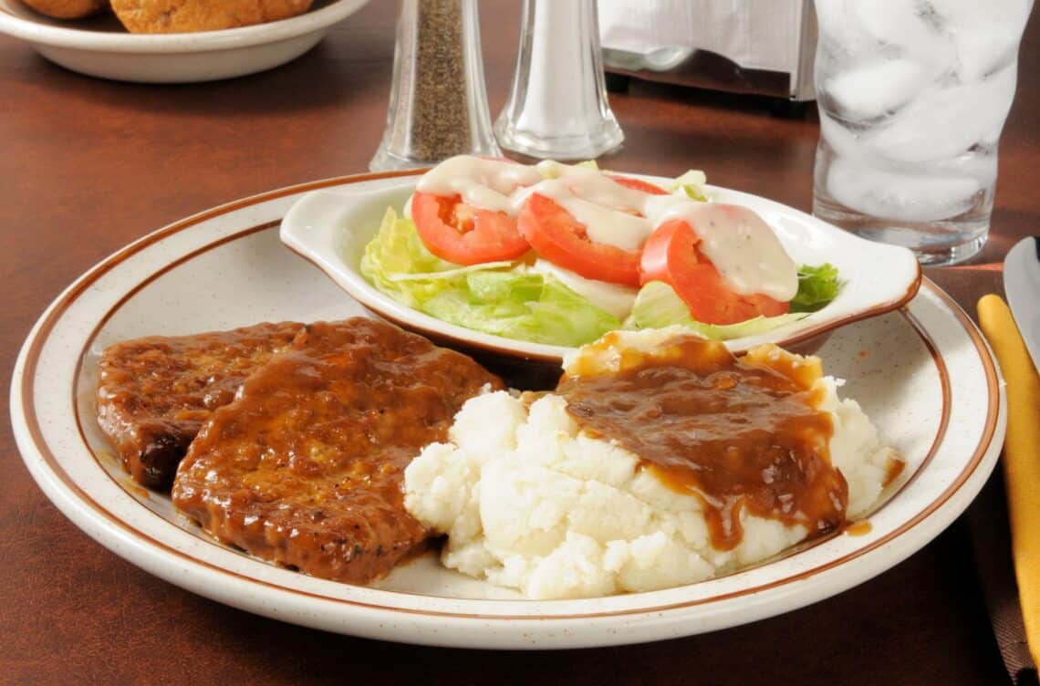 Delicious Cheddar Meatloaf With Mashed Potato And Vegetable Salad On The Side