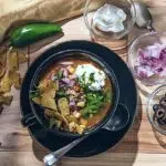 Simple And Delicious Chili Verde Served With Onions, Olives, Jalapeno, And Cheese