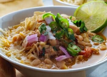 Chicken White Chili In A Bowl With Lime, Onion, Jalapeno