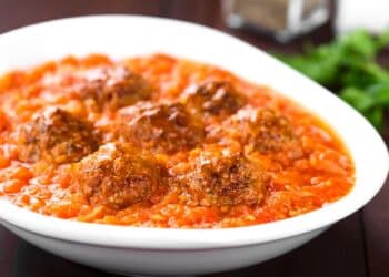 Irresistible Homemade Meatballs In Marinara Sauce In A White Bowl