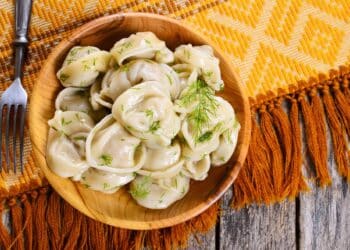 Stacks Of Delicious Pork And Cabbage Dumplings In A Bowl
