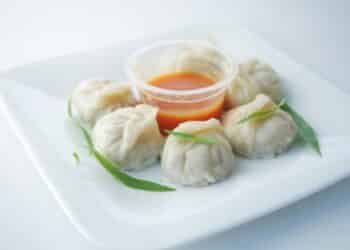 Hot, Steamy Chicken Momos With Spicy Sauce
