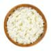 Cottage cheese, curds and whey in a wooden bowl