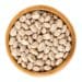 Pinto beans in wooden bowl over white