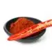 Red Hot Chili Pepper Powder And Half Isolated On White Background