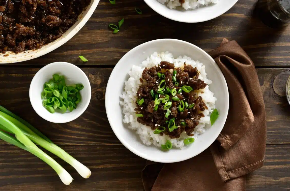 Mongolian Ground Beef Recipe On Rice Topped With Chopped Green Onion