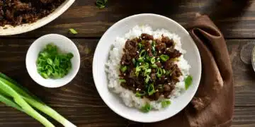 Mongolian Ground Beef Recipe On Rice Topped With Chopped Green Onion